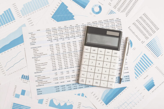 Business graphs, charts and calculator on table. Financial development, Banking Account, Statistics